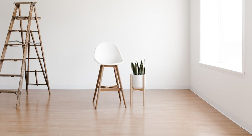 22. Bare, Echoing Hardwood Floors With No Rug (Image Credits: Unsplash)