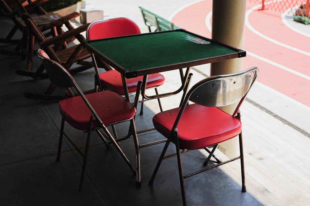 39. The Card Table and Folding Chairs (Image Credits: Unsplash)