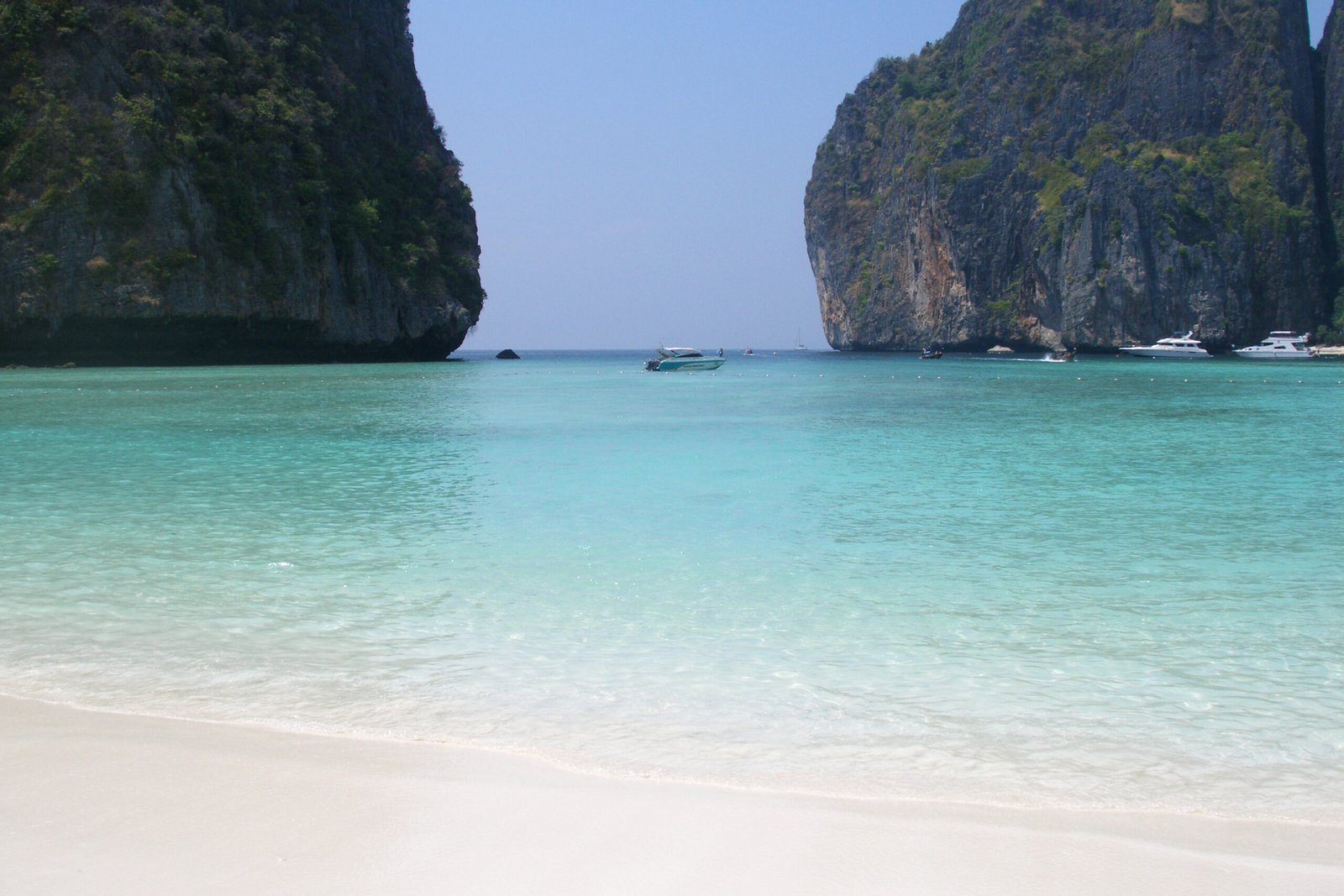 This is the lagoon featured in the film The Beach (2000) (Danny Boyle/Leonardo DiCaprio). The island consists of a ring of steep limestone hills surrounding two shallow bays. Maya Bay, Krabi, Thailand