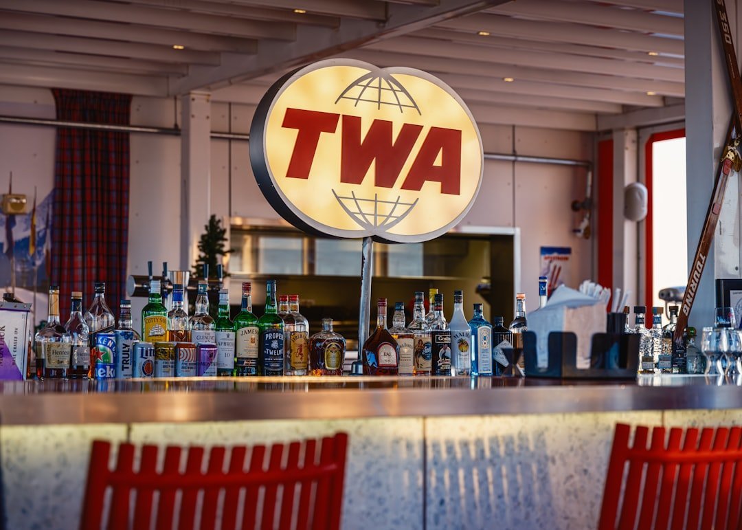 #6 - Getting Drunk at the Airport Bar Before Boarding (Image Credits: Unsplash)
